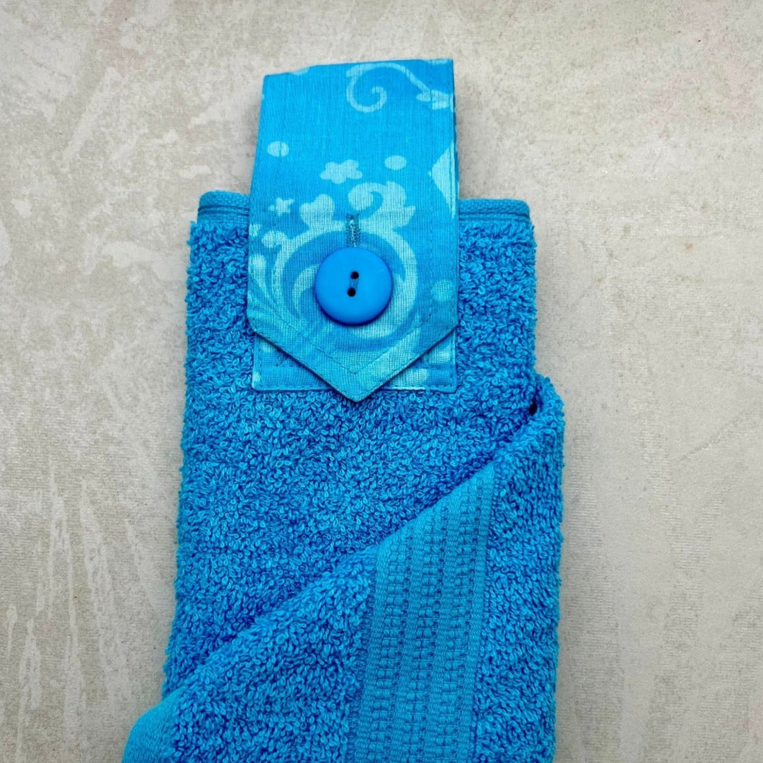 light blue modern hanging hand towel with blue button loop