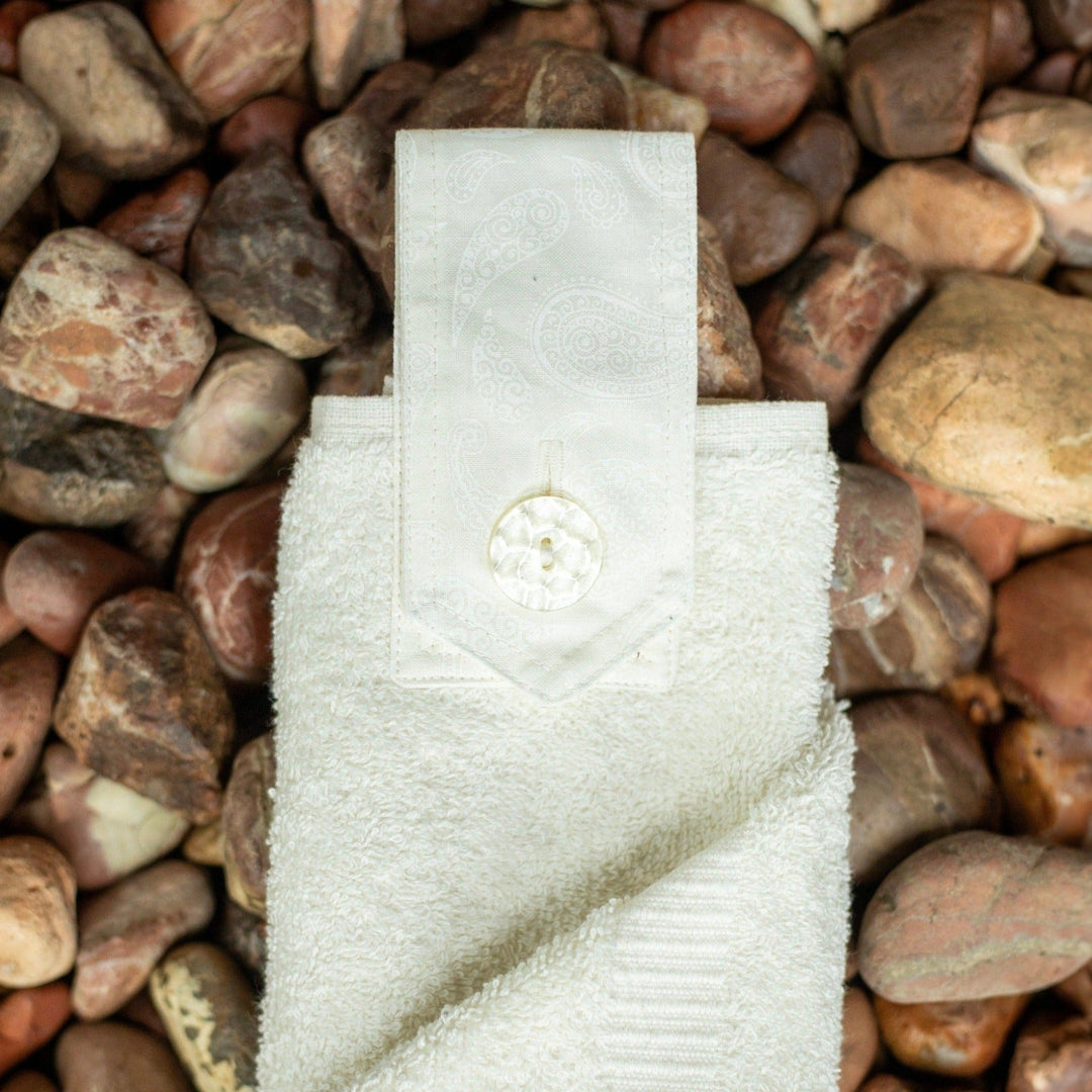 Snow White coloured hanging hand towel. Made using the whole premium hand towel and matching coloured quality cotton tab sewn to make a loop and secured with a beautiful modern button.