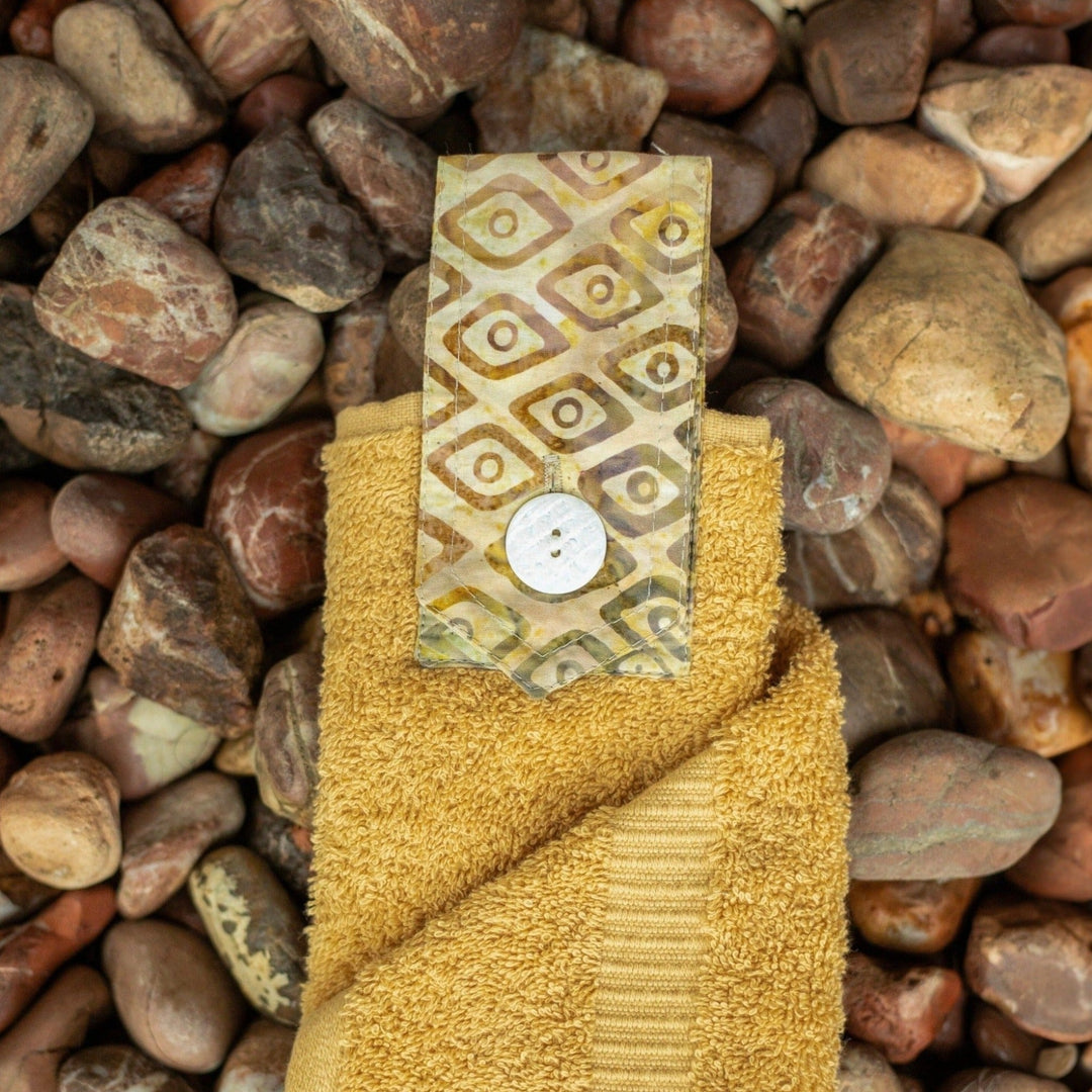 New wheat coloured hanging hand towel. Made using the whole premium hand towel and matching coloured quality cotton tab sewn to make a loop and secured with a beautiful modern button.