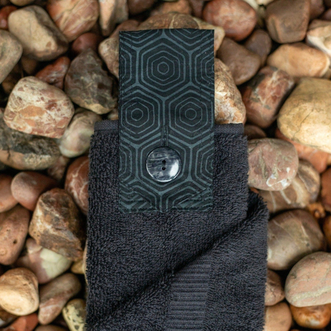 Jett black hanging hand towel. Made using the whole premium hand towel and quality cotton tab sewn to make a loop and secured with a beautiful modern button.